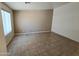 Spacious living room with tile flooring, neutral paint and natural light at 1918 S Ocotillo Dr, Apache Junction, AZ 85120