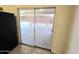 Living room with glass door to screened in patio, offering indoor-outdoor living at 1918 S Ocotillo Dr, Apache Junction, AZ 85120