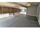 Inviting carpeted screened patio with ceiling fans and window coverings, perfect for entertaining at 1918 S Ocotillo Dr, Apache Junction, AZ 85120