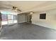 Spacious screened patio with ceiling fans and carpeted flooring, great for relaxing at 1918 S Ocotillo Dr, Apache Junction, AZ 85120