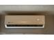 Close up view of a modern, wall-mounted air conditioning unit, providing climate control in the home at 2060 N Center St # 275, Mesa, AZ 85201