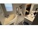 Bathroom featuring a soaking tub, patterned tile flooring, and a modern vanity at 2060 N Center St # 275, Mesa, AZ 85201
