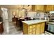 Open-concept kitchen flowing into the dining area, complete with a breakfast bar and bright lighting at 2060 N Center St # 275, Mesa, AZ 85201