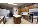This kitchen features a central island, additional counter space, and storage options at 2060 N Center St # 275, Mesa, AZ 85201