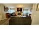 The living room shows a fireplace, comfortable seating, and large windows providing natural light at 2060 N Center St # 275, Mesa, AZ 85201