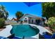 The backyard has a sparkling pool, covered patio, lush landscaping, and privacy, perfect for relaxation and outdoor entertaining at 2111 E Rawhide St, Gilbert, AZ 85296