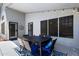 A charming covered patio area with a dining table set, perfect for outdoor entertaining at 2111 E Rawhide St, Gilbert, AZ 85296