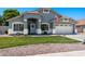 Charming single-story home with well-manicured lawn and a two-car garage at 2111 E Rawhide St, Gilbert, AZ 85296