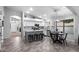 Bright kitchen with white cabinets, tiled backsplash, stainless appliances and eat-in nook at 2111 E Rawhide St, Gilbert, AZ 85296