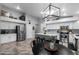 Modern kitchen with stainless steel appliances, white cabinetry, and center island at 2111 E Rawhide St, Gilbert, AZ 85296