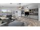 Cozy living room with a large sectional sofa, built-in bookshelves, and natural light at 2111 E Rawhide St, Gilbert, AZ 85296