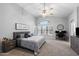 Spacious main bedroom with vaulted ceilings, a ceiling fan, and a cozy seating area at 2111 E Rawhide St, Gilbert, AZ 85296