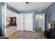 Bedroom/Office room showcasing an entrance to living area and ensuite at 2111 E Rawhide St, Gilbert, AZ 85296