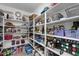 Walk-in pantry with floor-to-ceiling shelving, providing ample storage space at 2111 E Rawhide St, Gilbert, AZ 85296