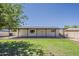 Covered patio overlooking a green backyard, creating an inviting outdoor living space at 2130 W Cindy St, Chandler, AZ 85224