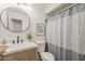 Updated bathroom featuring modern fixtures, vanity with sink, and neutral-toned shower curtain at 2130 W Cindy St, Chandler, AZ 85224