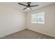 A bright bedroom features new carpet, a ceiling fan, and a window view at 2130 W Cindy St, Chandler, AZ 85224
