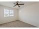 This bright bedroom has a large window and neutral carpet at 2130 W Cindy St, Chandler, AZ 85224