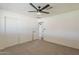 Well-lit bedroom with ceiling fan, closet, and neutral carpet at 2130 W Cindy St, Chandler, AZ 85224