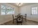 Bright dining room features a modern light fixture and a window view of a covered patio at 2130 W Cindy St, Chandler, AZ 85224