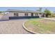 Inviting single-story home with decorative rock landscaping and covered carport, showing great curb appeal at 2130 W Cindy St, Chandler, AZ 85224