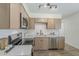This beautifully renovated kitchen features stainless steel appliances and modern white countertops at 2130 W Cindy St, Chandler, AZ 85224