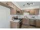 This beautifully renovated kitchen features stainless steel appliances and modern white countertops at 2130 W Cindy St, Chandler, AZ 85224