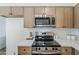 This beautifully renovated kitchen features stainless steel appliances and modern white countertops at 2130 W Cindy St, Chandler, AZ 85224
