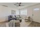 Comfortable living room featuring modern furnishings, a ceiling fan, and ample natural light at 2130 W Cindy St, Chandler, AZ 85224