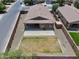 Aerial view of the home with a patio, lawn, and fenced backyard at 2264 W Arroyo Way, San Tan Valley, AZ 85144