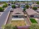 Aerial view of the home with a patio, shed, lawn, and fenced backyard at 2264 W Arroyo Way, San Tan Valley, AZ 85144