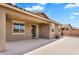 Covered back patio with sliding glass door access to the home's interior at 2264 W Arroyo Way, San Tan Valley, AZ 85144