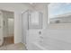 Ensuite bathroom features a soaking tub, glass shower, and a window for natural light at 2264 W Arroyo Way, San Tan Valley, AZ 85144