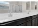 Ensuite bathroom with double sinks, and a glass-enclosed shower offers modern comfort at 2264 W Arroyo Way, San Tan Valley, AZ 85144