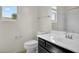 Bright bathroom featuring a single sink vanity, a toilet, and a shower with natural light at 2264 W Arroyo Way, San Tan Valley, AZ 85144