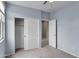 This cozy bedroom offers plush carpet, closet and backyard views at 2264 W Arroyo Way, San Tan Valley, AZ 85144