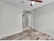 Cozy bedroom with wood-look flooring, ceiling fan, and neutral paint at 2264 W Arroyo Way, San Tan Valley, AZ 85144
