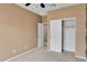 A bedroom with plush carpet, open closet and neutral walls and ceiling fan at 2264 W Arroyo Way, San Tan Valley, AZ 85144