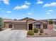 Charming single-story home with a two-car garage, desert landscaping, and a tiled roof at 2264 W Arroyo Way, San Tan Valley, AZ 85144