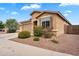 Inviting single-story home featuring a two-car garage and low maintenance desert landscaping at 2264 W Arroyo Way, San Tan Valley, AZ 85144
