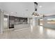 Open-concept kitchen with dark cabinets, granite countertops, and stainless steel appliances at 2264 W Arroyo Way, San Tan Valley, AZ 85144