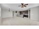 Spacious kitchen featuring dark cabinetry, a central island, and tile flooring at 2264 W Arroyo Way, San Tan Valley, AZ 85144