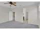 Bright and airy main bedroom with a ceiling fan and doorway leading to the ensuite bathroom at 2264 W Arroyo Way, San Tan Valley, AZ 85144