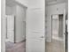 Spacious walk-in closet with an open door, shelves, and carpeted flooring at 2264 W Arroyo Way, San Tan Valley, AZ 85144