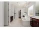 Elegant bathroom features a soaking tub, walk-in shower, and a view into the walk-in closet at 22944 E Via Del Oro --, Queen Creek, AZ 85142