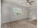 Bedroom featuring tile floors, light walls, and natural light from large windows at 22944 E Via Del Oro --, Queen Creek, AZ 85142