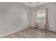 A cozy bedroom featuring tile floors, light walls, and natural light from the window at 22944 E Via Del Oro --, Queen Creek, AZ 85142