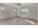 Bright bedroom featuring tile floors, light walls, and natural light from windows at 22944 E Via Del Oro --, Queen Creek, AZ 85142