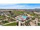 Aerial view of the resort-style community pool, seating areas, and meticulously manicured landscaping at 22944 E Via Del Oro --, Queen Creek, AZ 85142