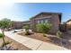 Beautiful single-story home with desert landscaping, gravel, and a sidewalk leading to the entrance at 22944 E Via Del Oro --, Queen Creek, AZ 85142